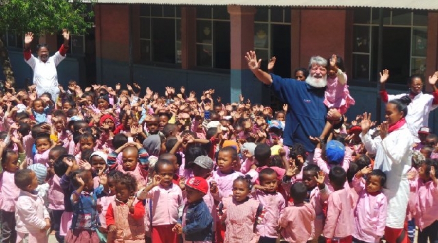 father pedro and kids at akamasoa